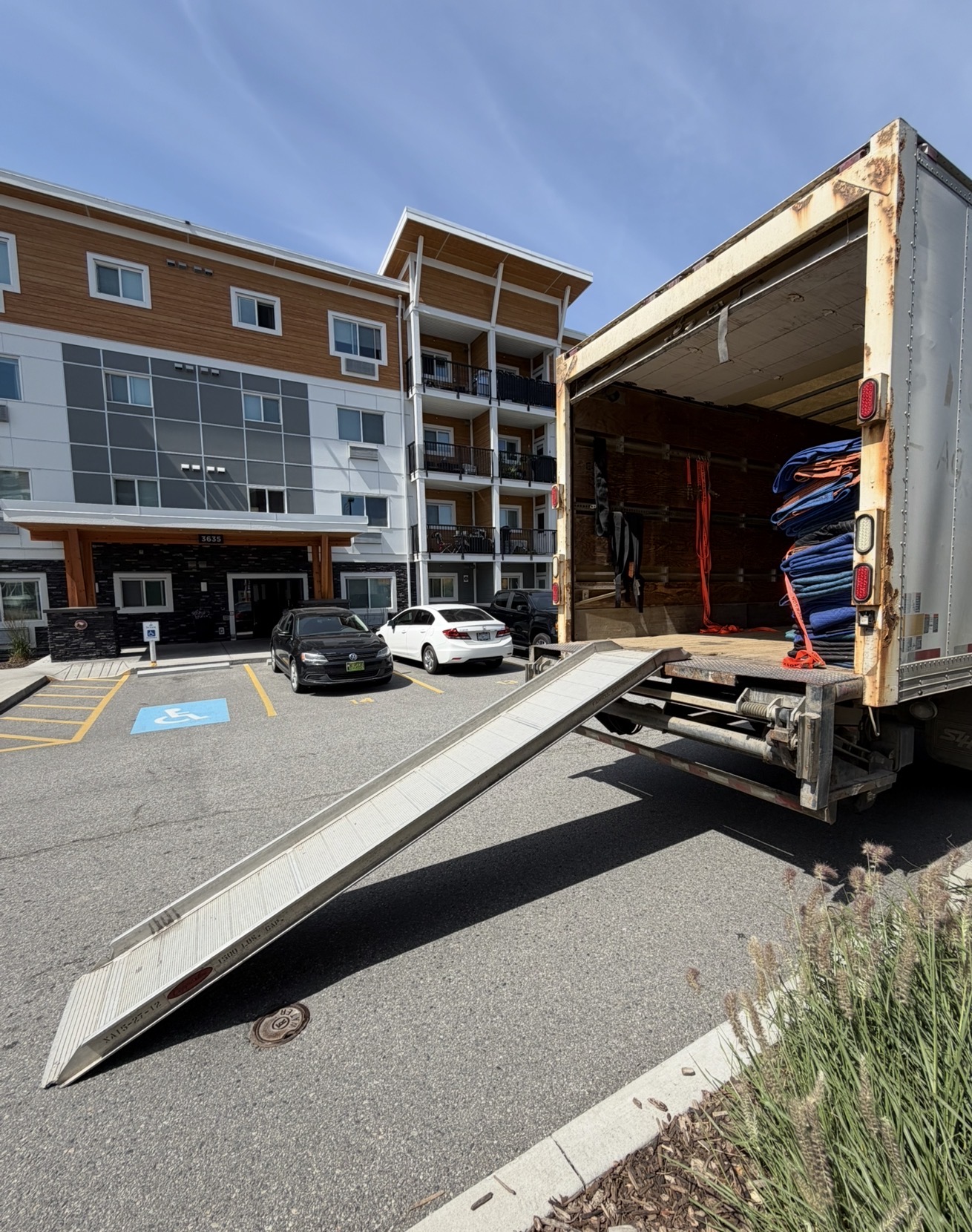 Horizon Moving truck with loading ramp at a Kelowna apartment building